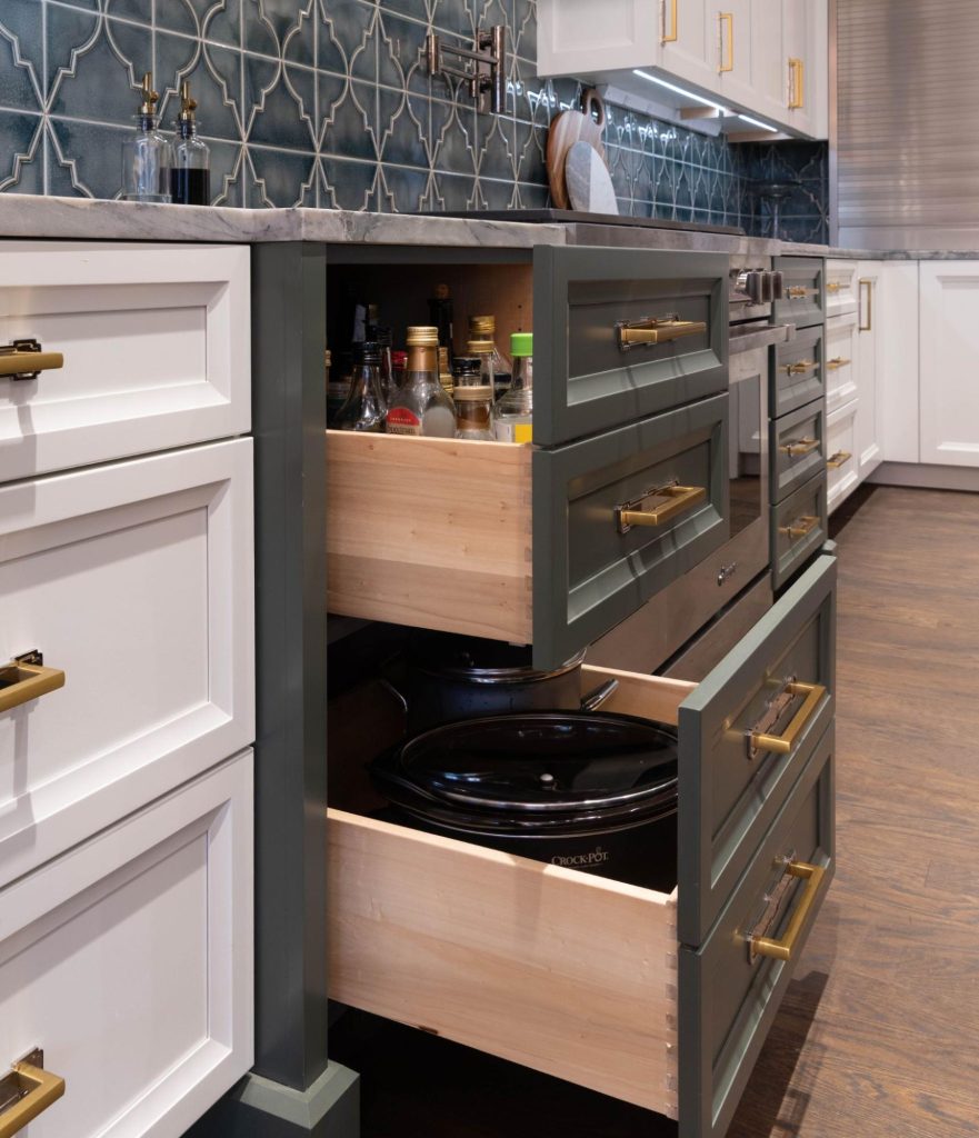 (pull-out storage drawers): Custom cabinet design idea using deep pull-out drawers for pantry and cookware storage, Kitchen Design Concepts Dallas kitchen